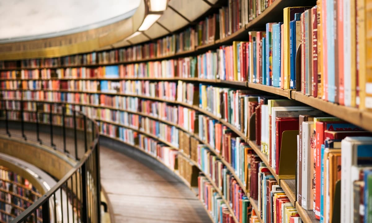 Curved bookshelves filled with colorful books
